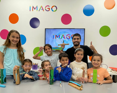 group of children with company leader learning about bamboo toothbrushes