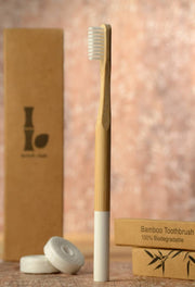 biodegradable bamboo toothbrush and floss, front view