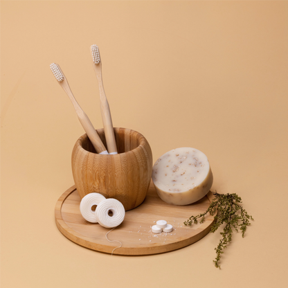 Sustainable Dental Kit with biodegradable bamboo toothbrushes and floss, front angle